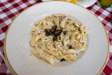 fuzi istrian pasta with black truffle tartufo mashroom and cream traditional food in Rovinj Croatia
