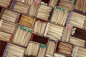 multicolored match sticks in boxes