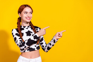 Photo of dreamy cute woman wear cow skin top looking pointing two fingers empty space isolated...