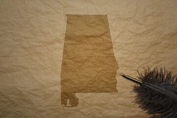 map of alabama state on a old paper background with old pen