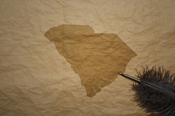 map of south carolina state on a old paper background with old pen
