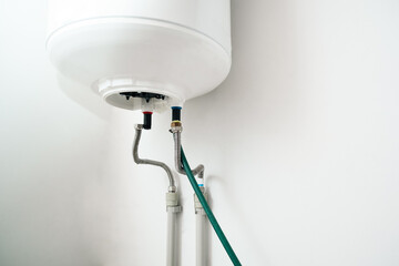 Repair and maintenance of storage water heater. Drain the water from the boiler. Plumbing work.