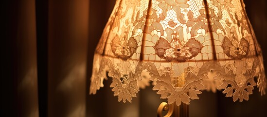 Vintage lace lampshade closeup with glowing light bulb inside Retro lamp adorned with intricate textile and ribbons Old fashioned decor