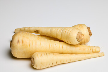 parsley root on a white table.