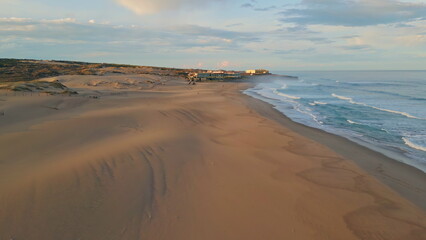 Tranquil sea surf evening nature in slow motion. Picturesque aerial hills beach
