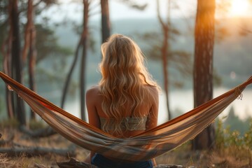 A peaceful setting as a woman enjoys solitude in a hammock amidst a forest, the sunset providing a tranquil backdrop