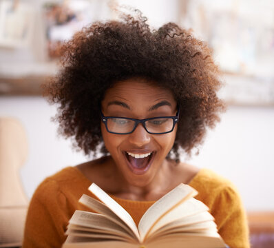 Book, excited and happy woman in home lounge, reading and shocked expression. Pages, relax and novel or fiction for female reader with glasses, literacy or knowledge for hobby and surprise story line