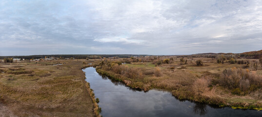 Fototapeta na wymiar Aerial panorama on autumn river valley with clouds