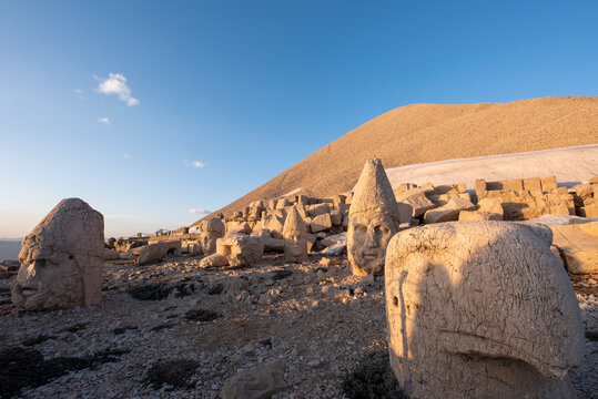 Nemrut ancient ruins statue heads on top of the mountain snowy day blue sky stars at night