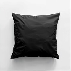 A sleek black square pillow is featured prominently against a stark white background. The pillow displays a smooth satin-like material with a subtle sheen, giving it a luxurious appearance. Its surfac