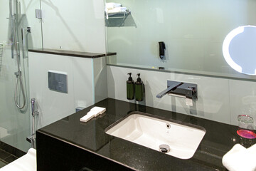 Modern bathroom interior with illuminated mirrors