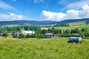 
Rural summer landscape. Village Smerekowiec on a sunny summer day, Low Beskids (Beskid Niski), Poland - obrazy, fototapety, plakaty