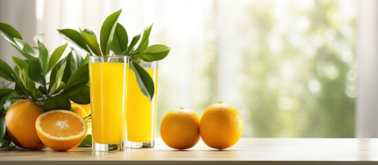 Refreshing Glass of Citrus Orange Juice with Ice Cubes on Wooden Table