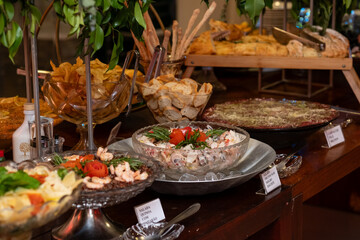 table with snacks, table setting, food, buffet, seafood salad
