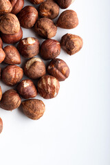 Hazelnuts on a white background. Top view, copy space