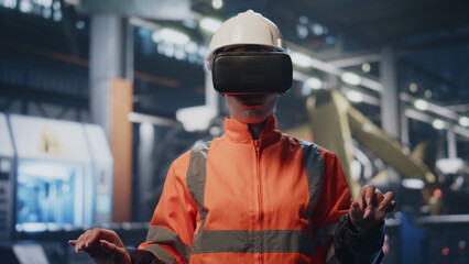 Worker vr goggles touching augmented reality simulation at factory close up.