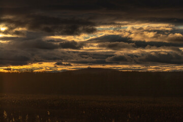 Sunset over the marsh creates a beautiful cloudscape