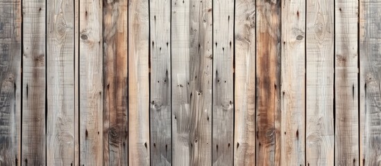 Aged wooden surface with long boards aligned. Wood planks on wall or floor with grain and texture. Faded light neutral tones.