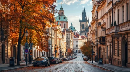 Fotobehang Autumn foliage with street and beautiful historical buildings of Prague city in Czech Republic in Europe. © Joyce