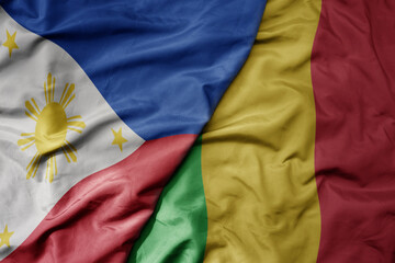 big waving national colorful flag of mali and national flag of philippines.
