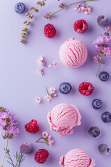 Ice cream, blueberries, raspberries and flowers on light violet background. Top view. Pastel colors.