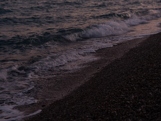waves on the beach in the evening