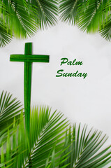 Palm cross and palm leaves, white background, and copy space. Palm Sunday and easter day concept.