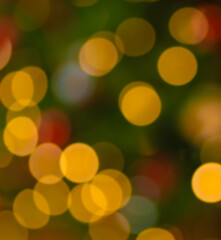 Bright lights on a Christmas tree in bokeh for a background