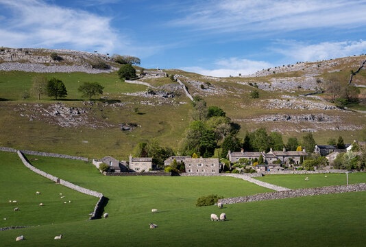 Village of Feizor in spring backed by Pot Scar, Yorkshire Dales National Park, Yorkshire, England