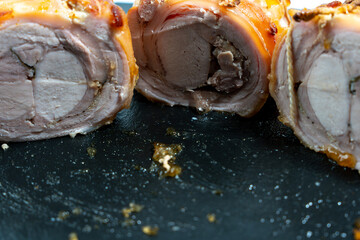 Baked pork wrapped in a roll. Pork roll close-up.
