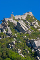 The Castelo dos Mouros is located on a hill above the Portuguese town of Sintra. Since 1995 on the...