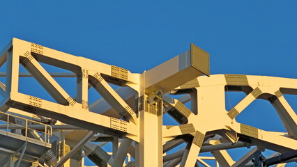 works in madrid soccer stadium structures metal beams with rivets on blue background