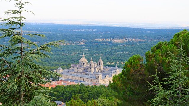 Escorial monastery from Abantos between pine forests sunset architecture Madrid tourism