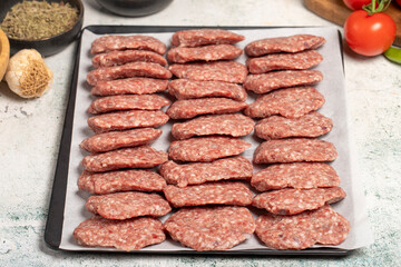 Beef meatballs. Butcher products. Raw beef meatballs on stone background