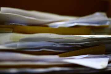 Stack of papers, files, data, archives, profiles and other documentation in the office.