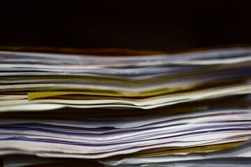 Stack of papers, files, data, archives, profiles and other documentation in the office.