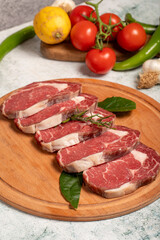 Beef entrecôte or ribeye. Butcher products. Raw beef ribeye on stone background