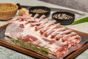 Lamb chops or lattice. Butcher products. Unsliced raw lamb chops on stone background