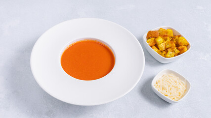 Tomato soup bowl with crackers