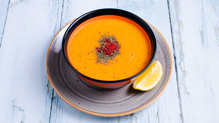 Lentil soup bowl with lemon