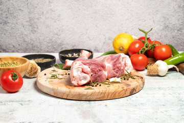 Lamb's shank. Butcher products. Lamb shank steak with bones on stone background