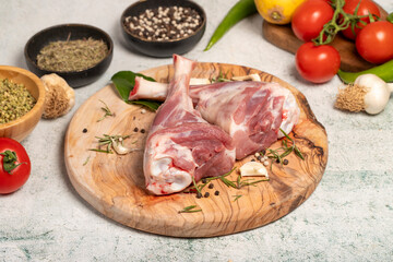 Lamb's shank. Butcher products. Lamb shank steak with bones on stone background