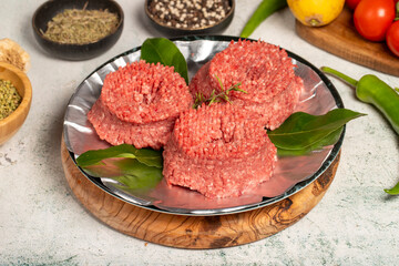 Ground beef. Butcher products. Raw ground beef on stone background