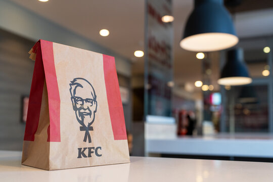 KFC paper bag with Kentucky Fried Chicken on the table of a KFC restaurant. Minsk, Belarus - March 8, 2024