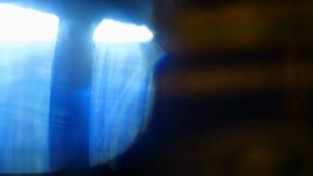 Colorful light leak, lens flare bogeh on dark background. Spectrum, rainbow colors. Motion graphic/illustration