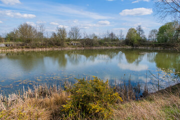 Fototapeta na wymiar a fishing lake created from disused quarry