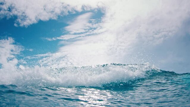 Ocean wave breaks on the camera