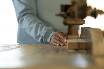 man working in a carpentry shop. Photographs of the work and backgrounds for publications with copy space.