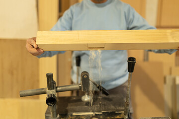 man working in a carpentry shop. Photographs of the work and backgrounds for publications with copy space.