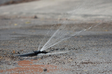 Water main pipe leak in the middle of the street